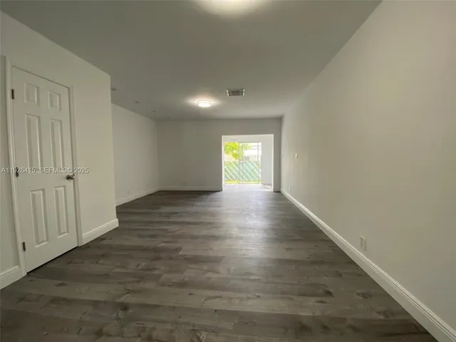 a view of an empty room and window