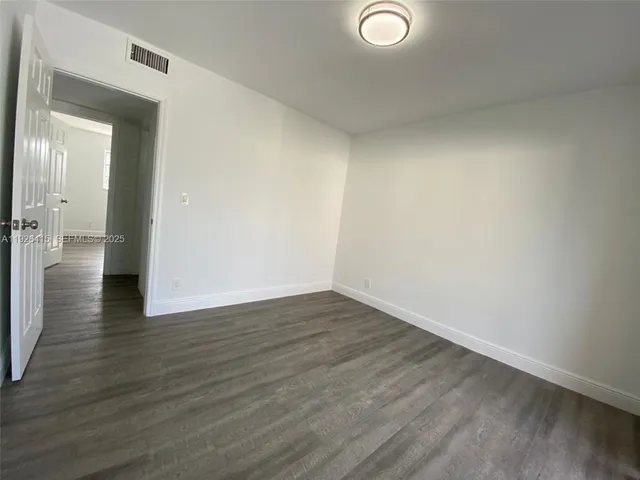 a view of livingroom with hardwood floor and hallway