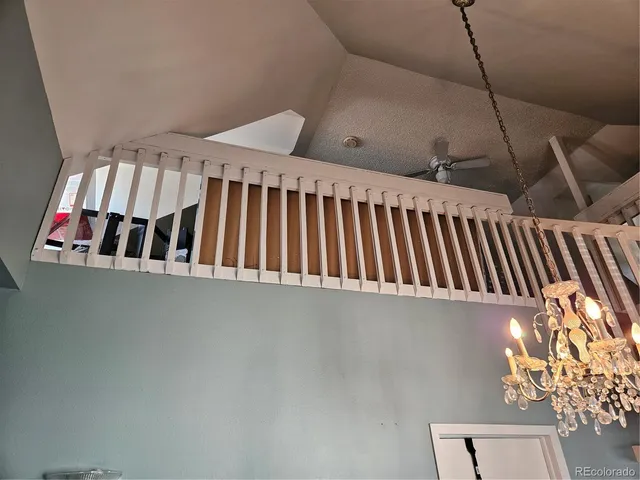 a view of staircase with black and white wall