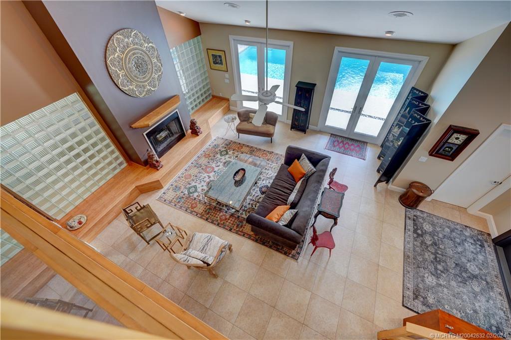 132 South River Road Stuart, FL 34996 - Photo 15 of 45 a living room with furniture and a clock