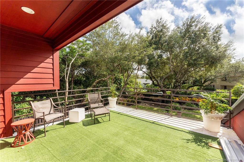 132 South River Road Stuart, FL 34996 - Photo 17 of 45 a view of a chairs and table in patio with swimming pool