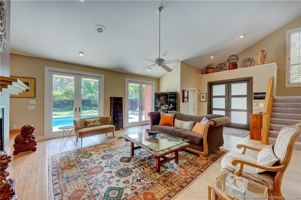 132 South River Road Stuart, FL 34996 - Photo 3 of 45 a living room with furniture a rug and a large window