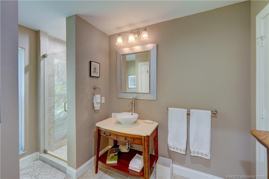 132 South River Road Stuart, FL 34996 - Photo 31 of 45 a bathroom with a sink and a mirror