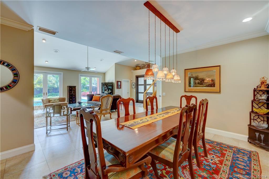 132 South River Road Stuart, FL 34996 - Photo 6 of 45 a dining room with furniture and wooden floor