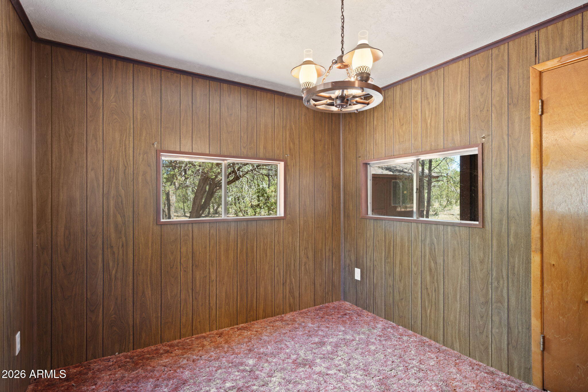 2943 Buckskin Road Overgaard, AZ 85933 - Photo 22 of 36 a view of a livingroom with a chandelier fan