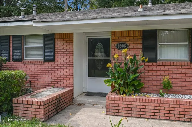 a house with a potted plant on it