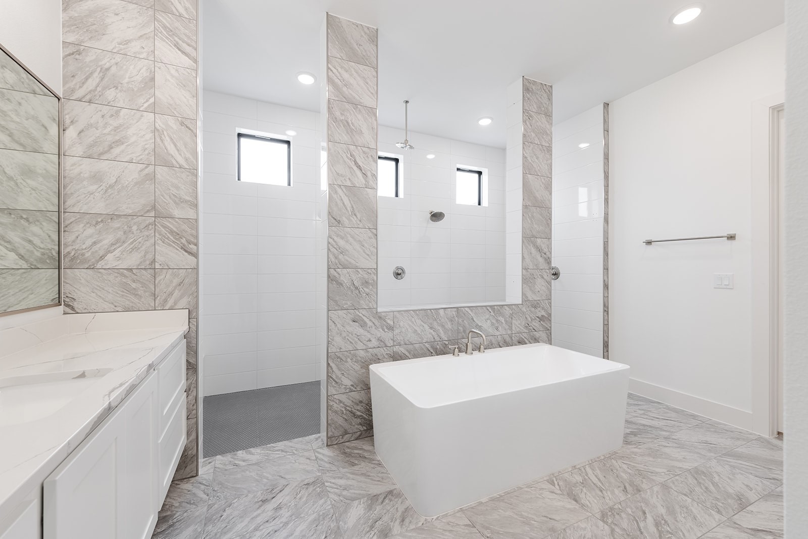 2385 Lineage Lane Leander, TX 78641 - Photo 11 of 36 a bathroom with a bathtub and a sink