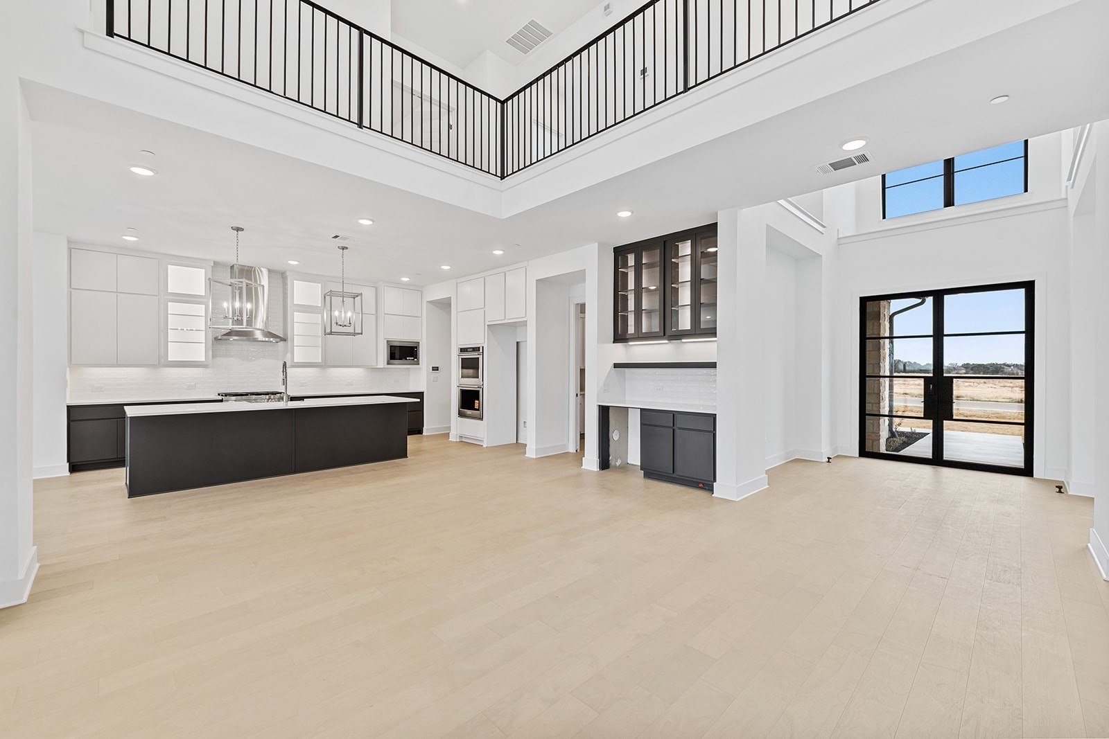 2385 Lineage Lane Leander, TX 78641 - Photo 13 of 36 a view of an empty room with kitchen and window