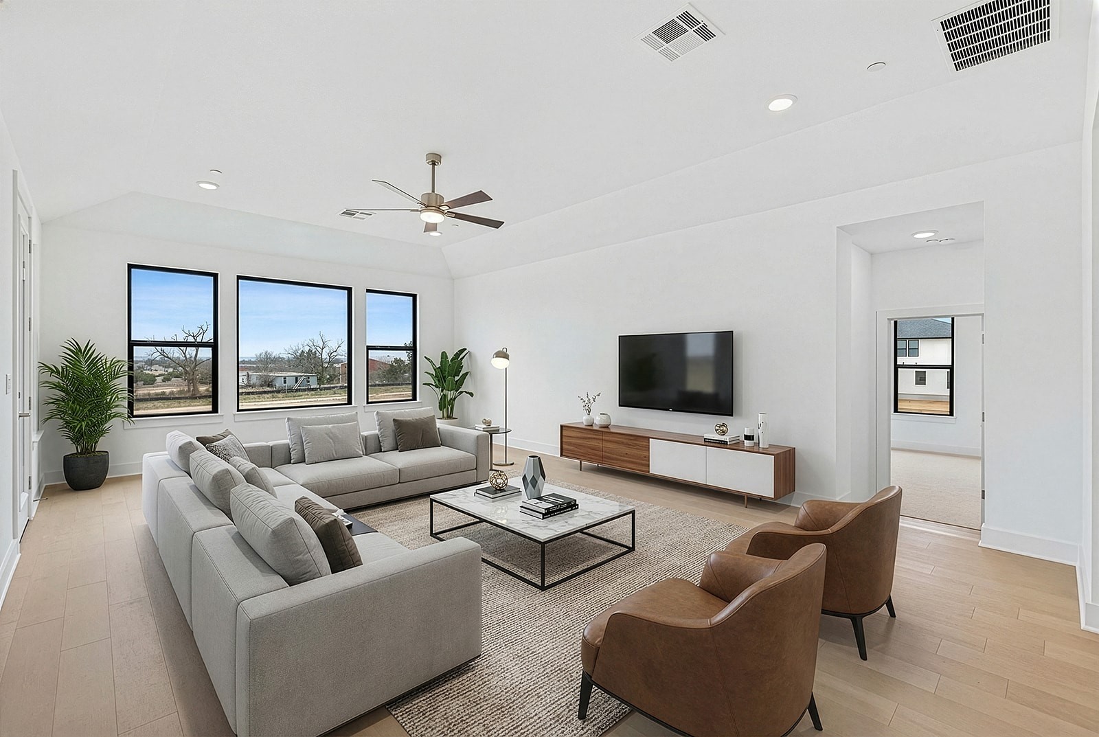 2385 Lineage Lane Leander, TX 78641 - Photo 16 of 36 a living room with furniture and a flat screen tv