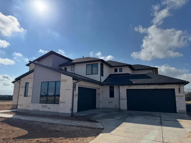 a front view of a house with yard