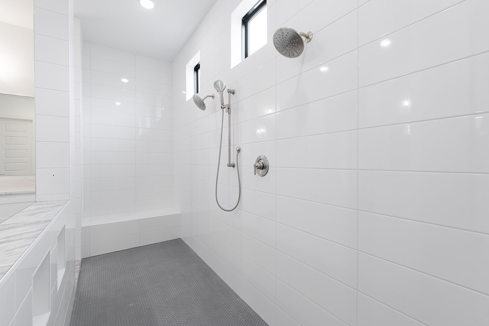 2385 Lineage Lane Leander, TX 78641 - Photo 21 of 36 a bathroom with a glass shower door