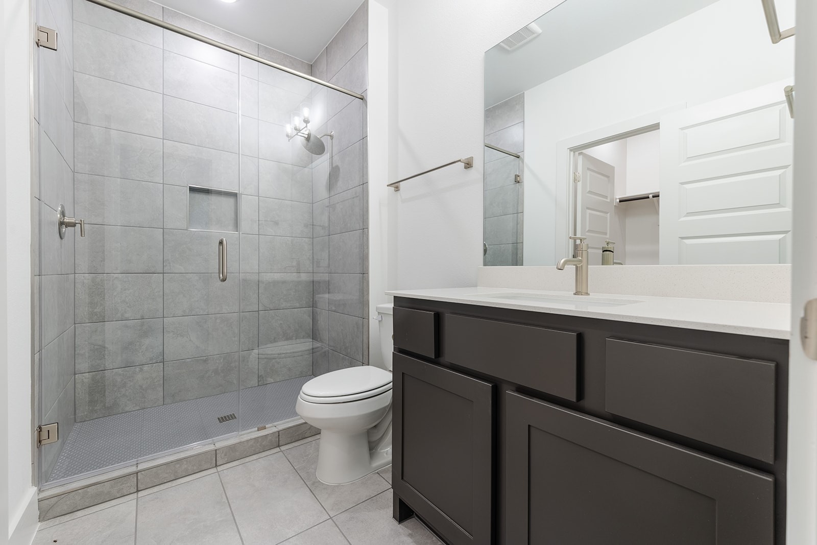 2385 Lineage Lane Leander, TX 78641 - Photo 22 of 36 a bathroom with a sink a toilet and shower