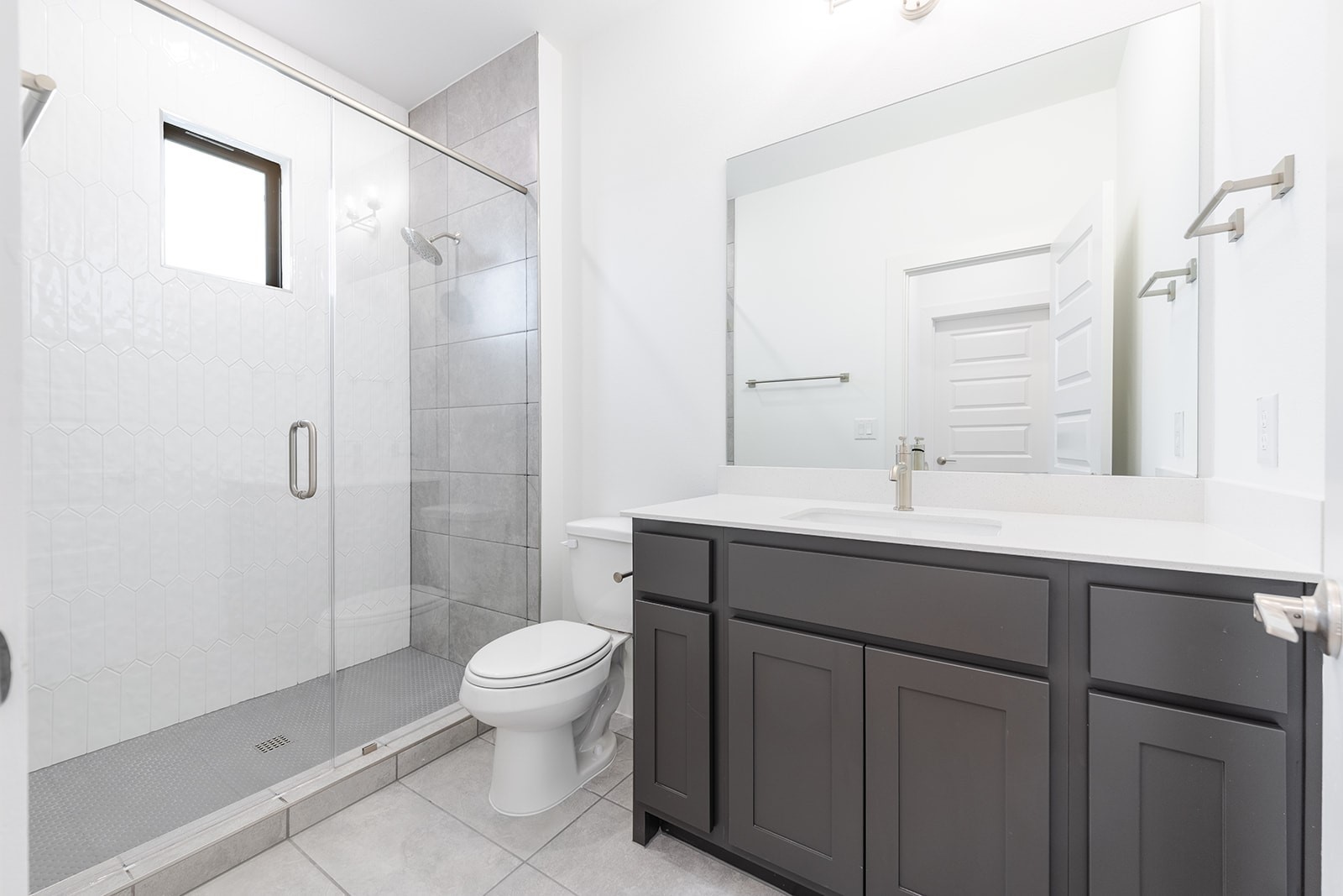 2385 Lineage Lane Leander, TX 78641 - Photo 23 of 36 a bathroom with a sink toilet a mirror and shower