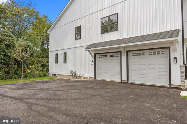 a front view of a house with a garage