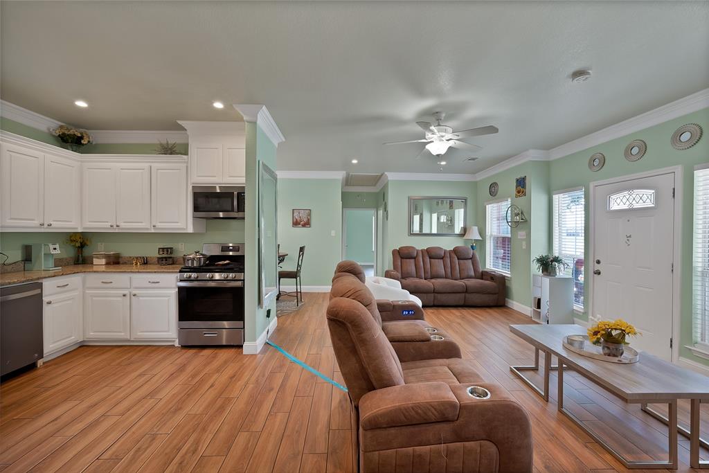 2410 Carleta Street Dallas, TX 75253 - Photo 12 of 29 a living room with furniture kitchen view and a refrigerator