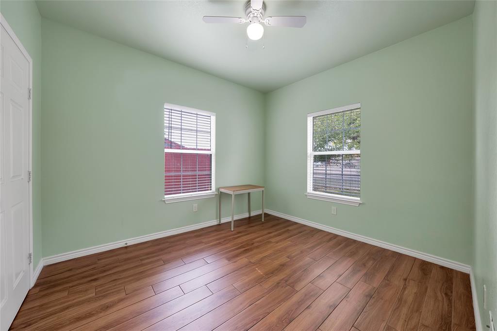 2410 Carleta Street Dallas, TX 75253 - Photo 17 of 29 a view of a room with wooden floor and windows