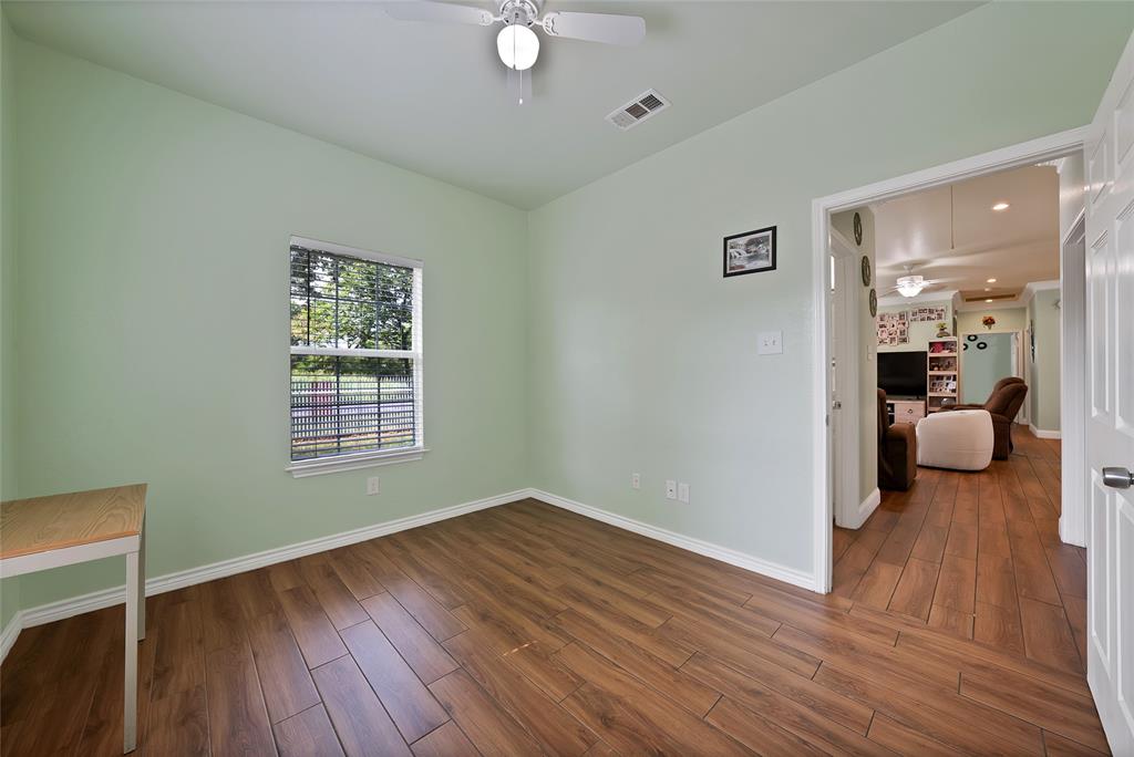 2410 Carleta Street Dallas, TX 75253 - Photo 18 of 29 a view of a room wooden floor and a cabinet