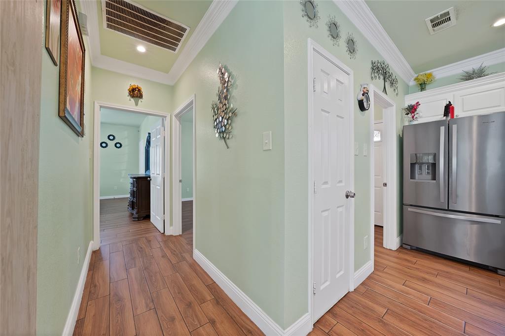 2410 Carleta Street Dallas, TX 75253 - Photo 19 of 29 a view of a hallway with wooden floor and staircase