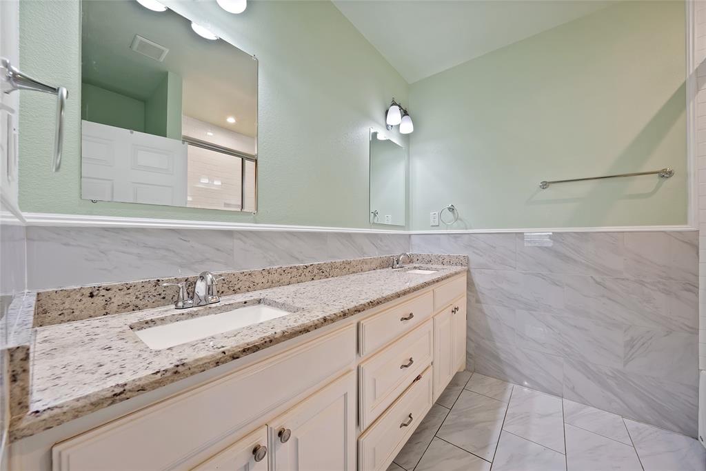 2410 Carleta Street Dallas, TX 75253 - Photo 25 of 29 a bathroom with a granite countertop sink and a mirror