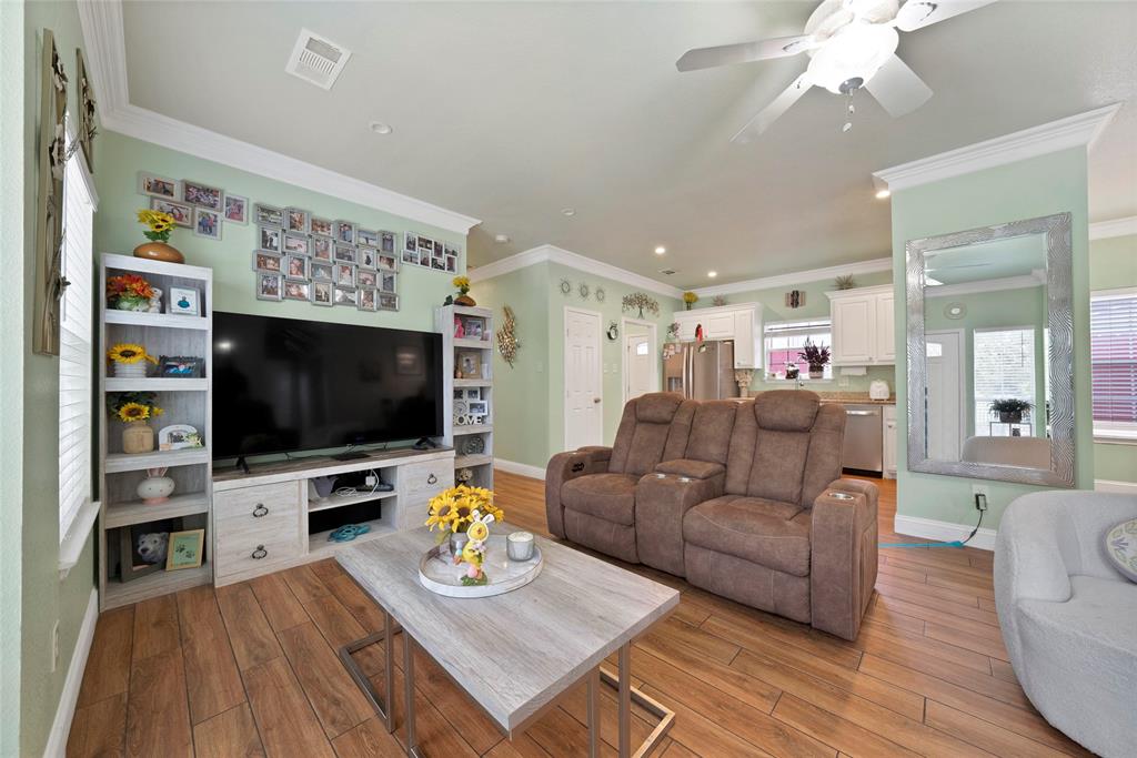 2410 Carleta Street Dallas, TX 75253 - Photo 6 of 29 a living room with furniture and a flat screen tv