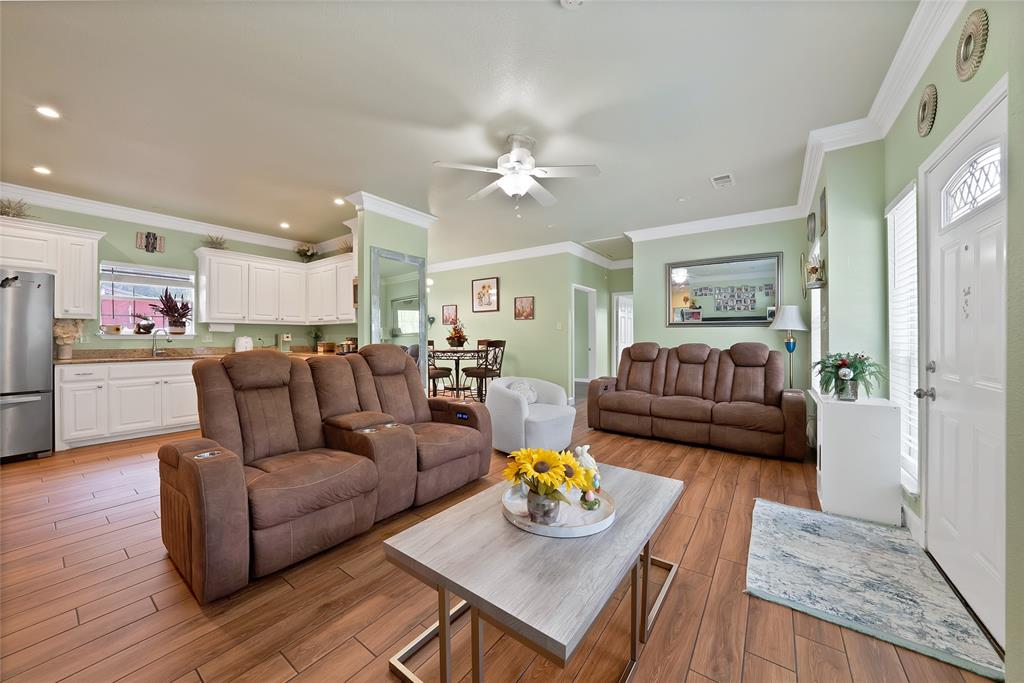 2410 Carleta Street Dallas, TX 75253 - Photo 7 of 29 a living room with furniture fireplace and wooden floor