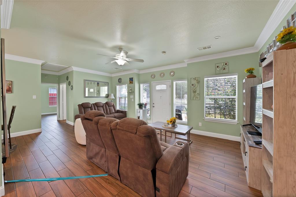 2410 Carleta Street Dallas, TX 75253 - Photo 8 of 29 a living room with furniture and a wooden floor