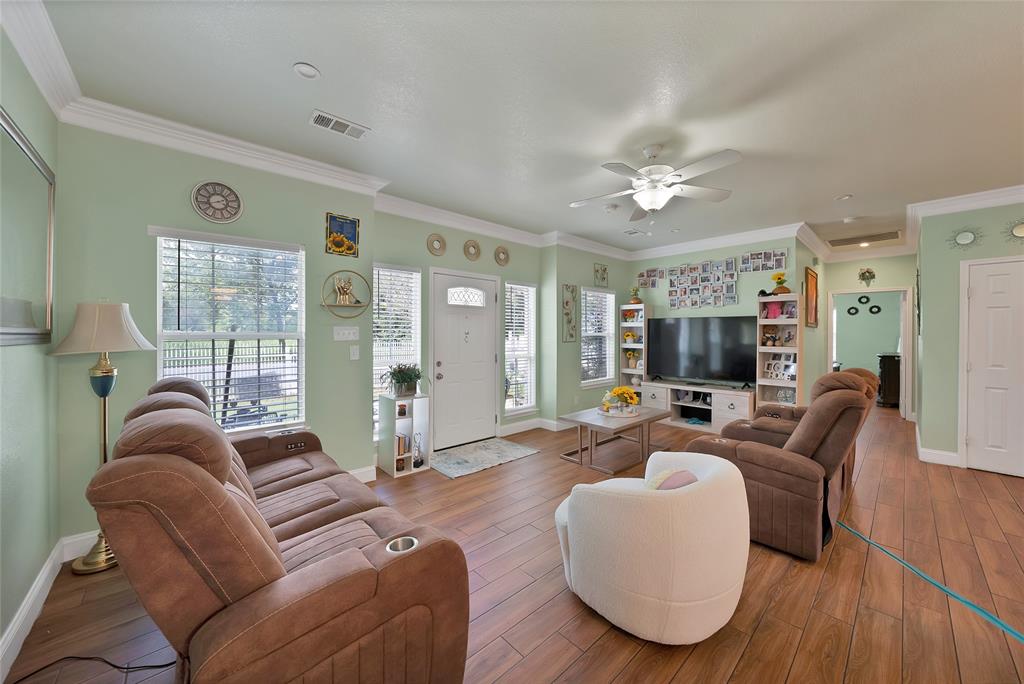 2410 Carleta Street Dallas, TX 75253 - Photo 9 of 29 a living room with furniture a flat screen tv and a large window