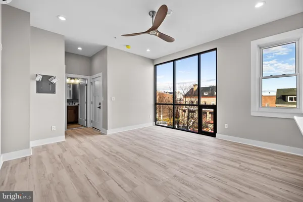 a view of an empty room with a window