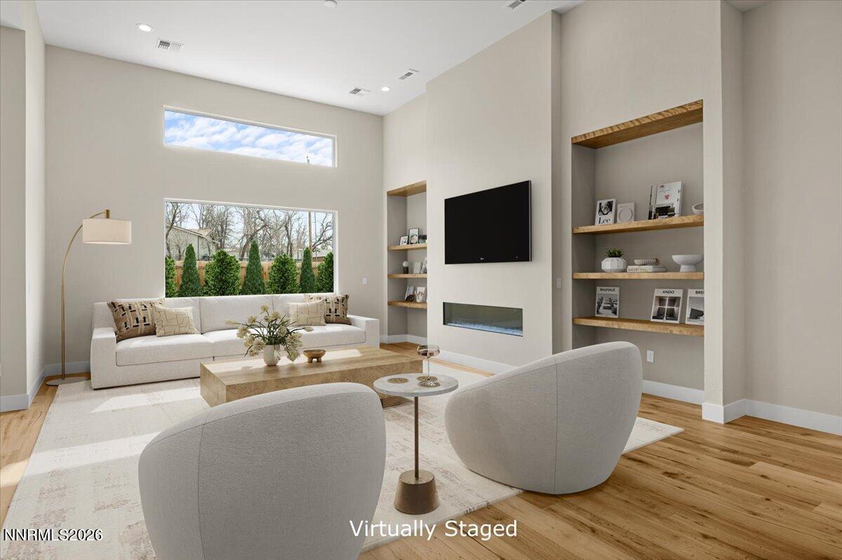 2982 Saddle Peak Drive Reno, NV 89521 - Photo 24 of 98 a living room with fireplace furniture and a flat screen tv