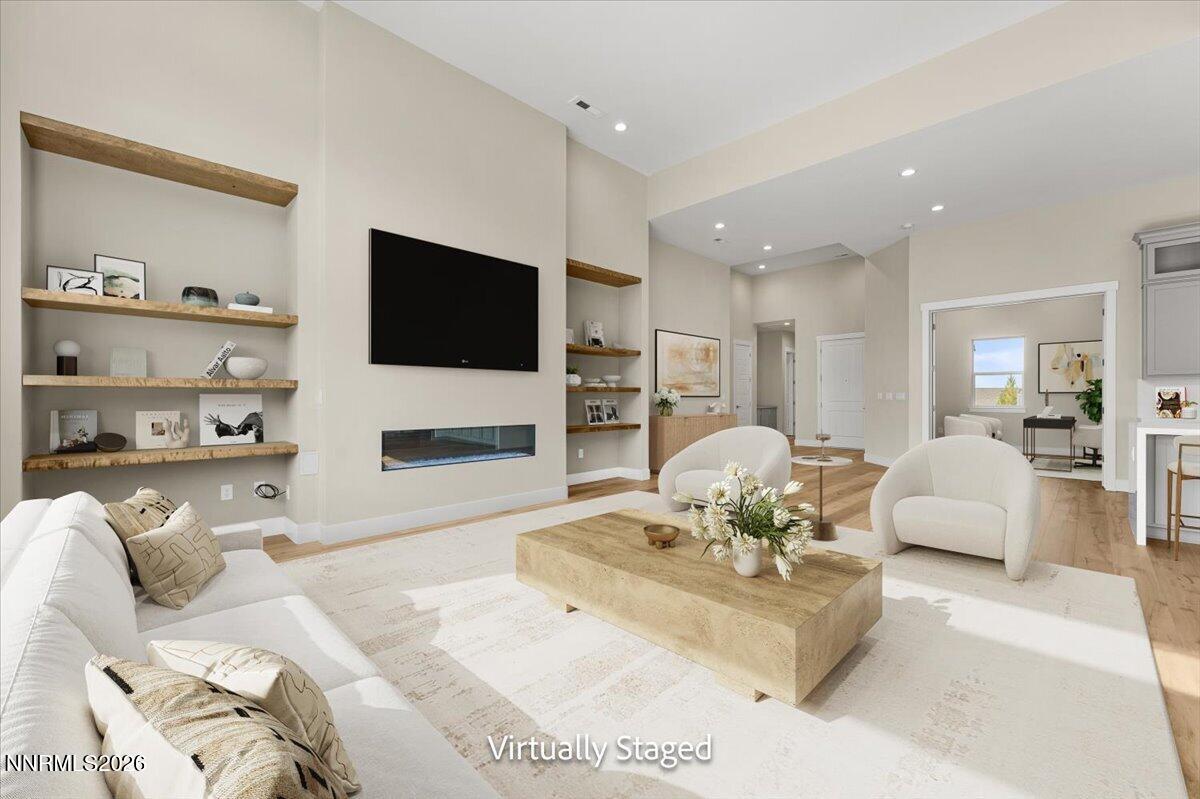 2982 Saddle Peak Drive Reno, NV 89521 - Photo 26 of 98 a living room with furniture a fireplace and a flat screen tv