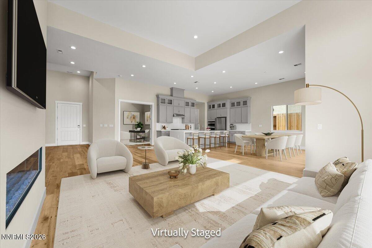 2982 Saddle Peak Drive Reno, NV 89521 - Photo 27 of 98 a living room with furniture and a flat screen tv