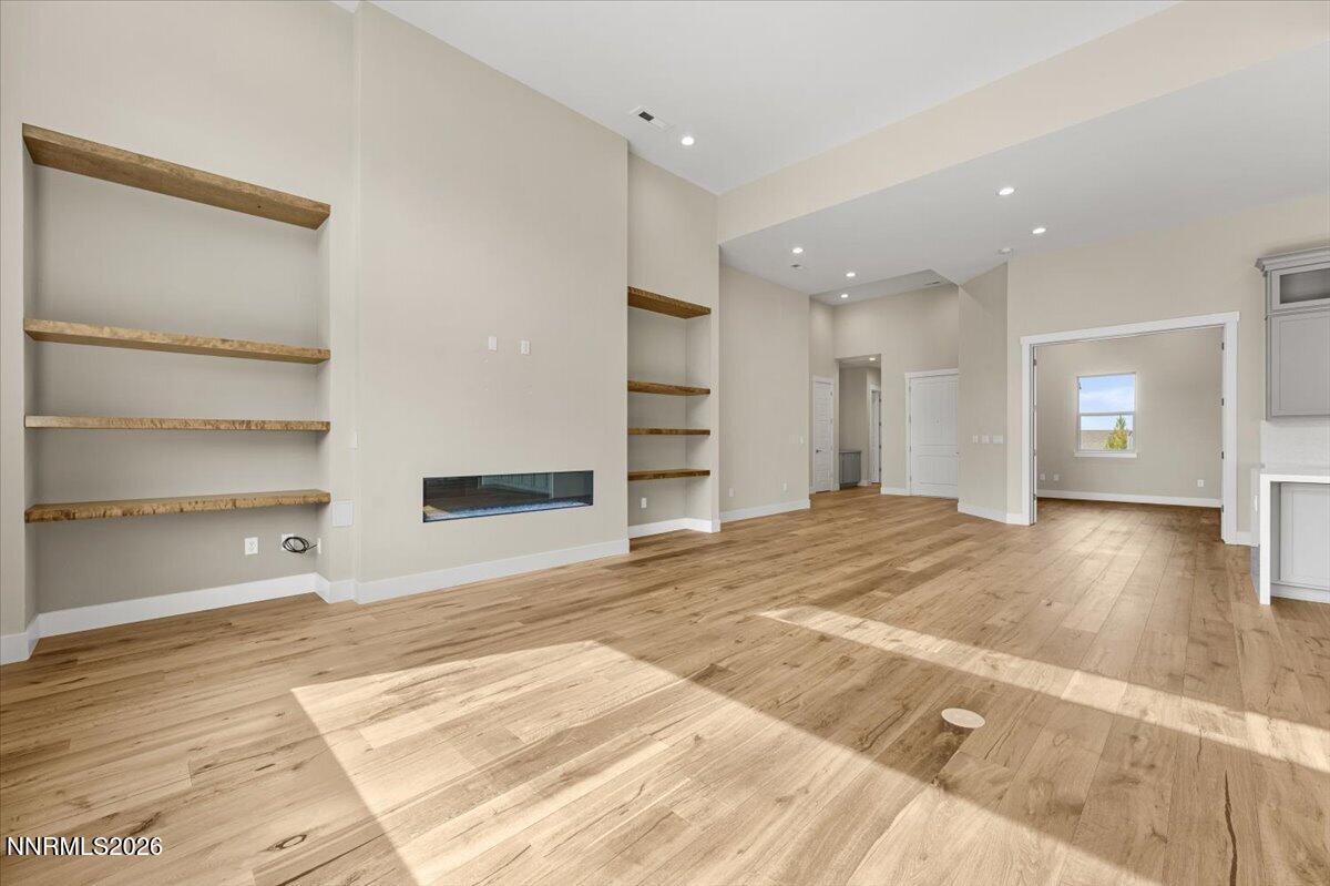 2982 Saddle Peak Drive Reno, NV 89521 - Photo 35 of 98 a view of an empty room with a window and wooden floor
