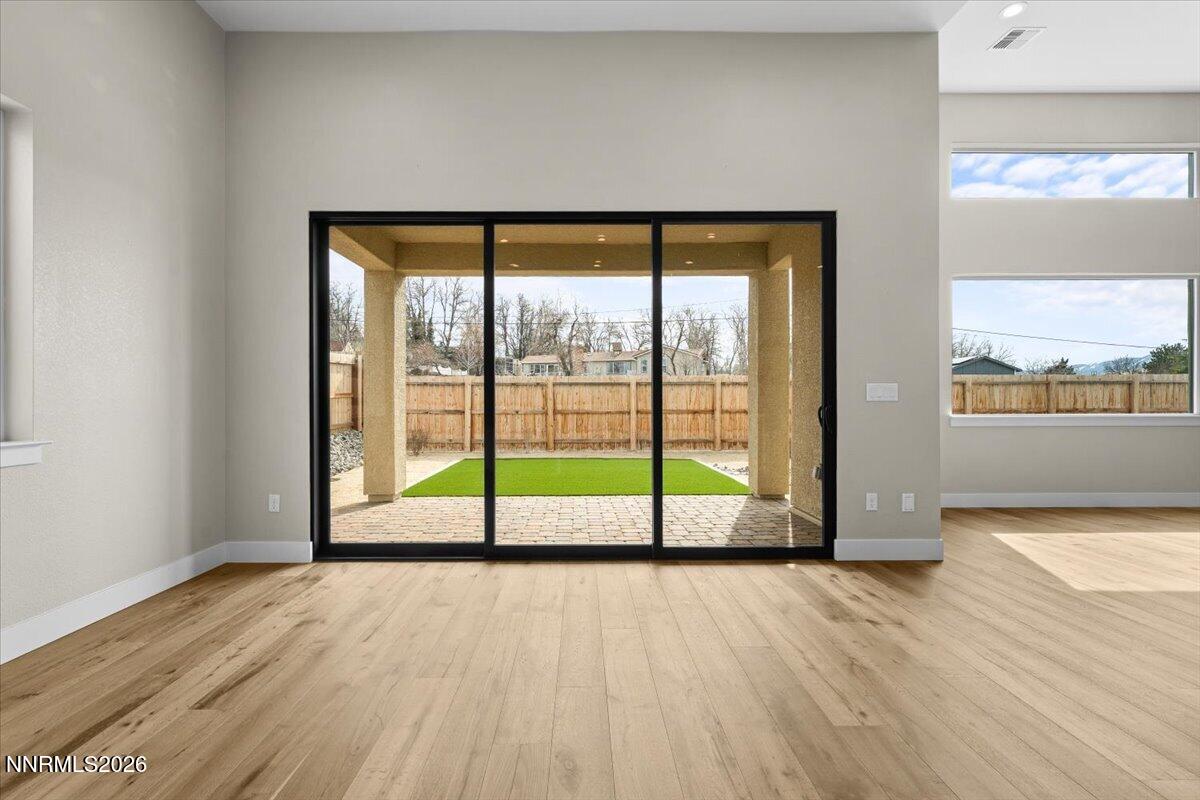 2982 Saddle Peak Drive Reno, NV 89521 - Photo 43 of 98 a view of an empty room with wooden floor and a window