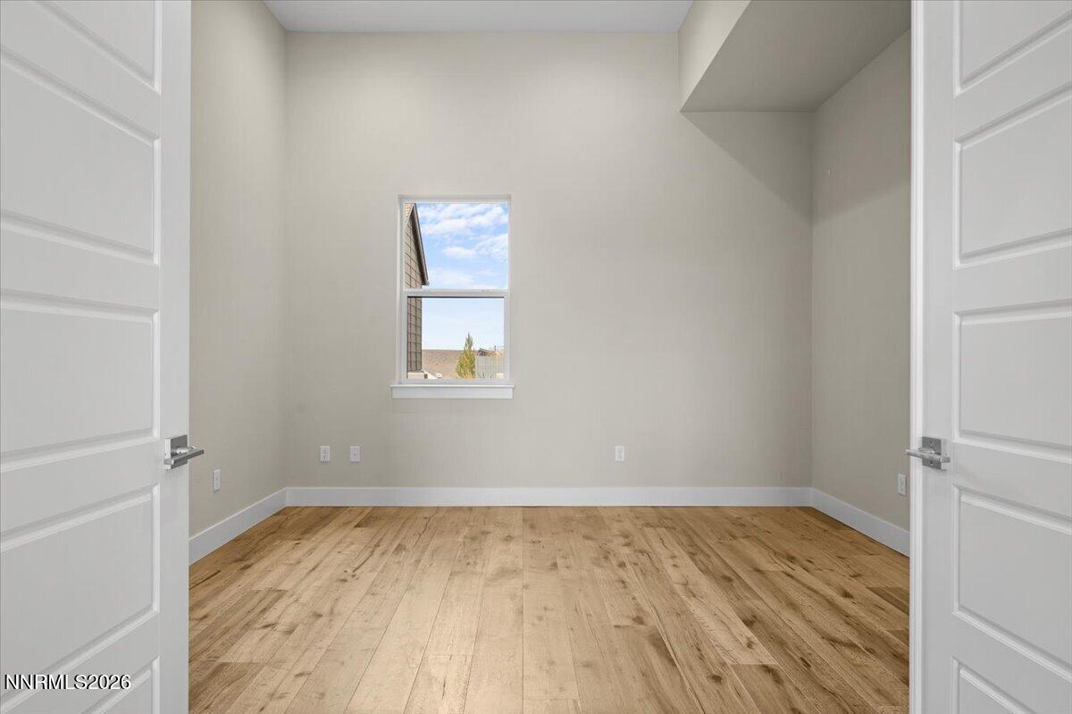 2982 Saddle Peak Drive Reno, NV 89521 - Photo 47 of 98 a view of a room with wooden floor and a window