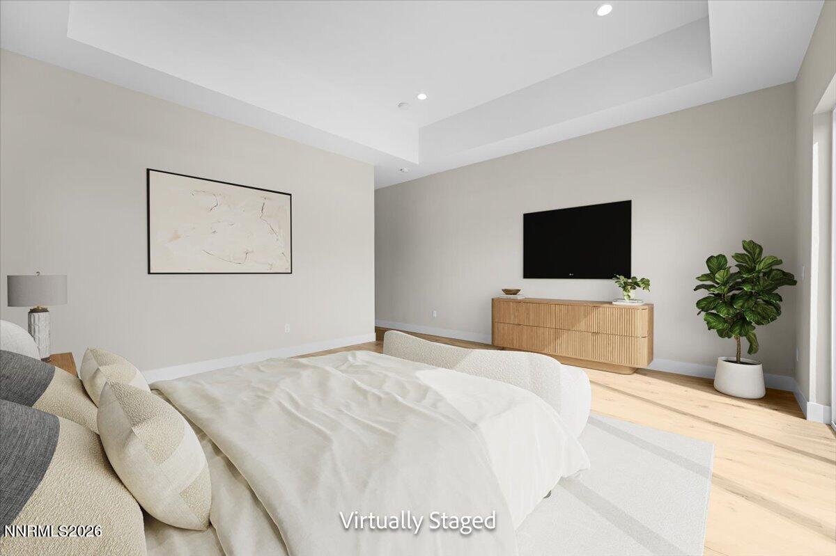 2982 Saddle Peak Drive Reno, NV 89521 - Photo 52 of 98 a bedroom with a bed and a flat screen tv