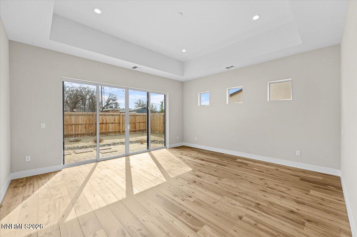 2982 Saddle Peak Drive Reno, NV 89521 - Photo 59 of 98 a view of an empty room with wooden floor and a window