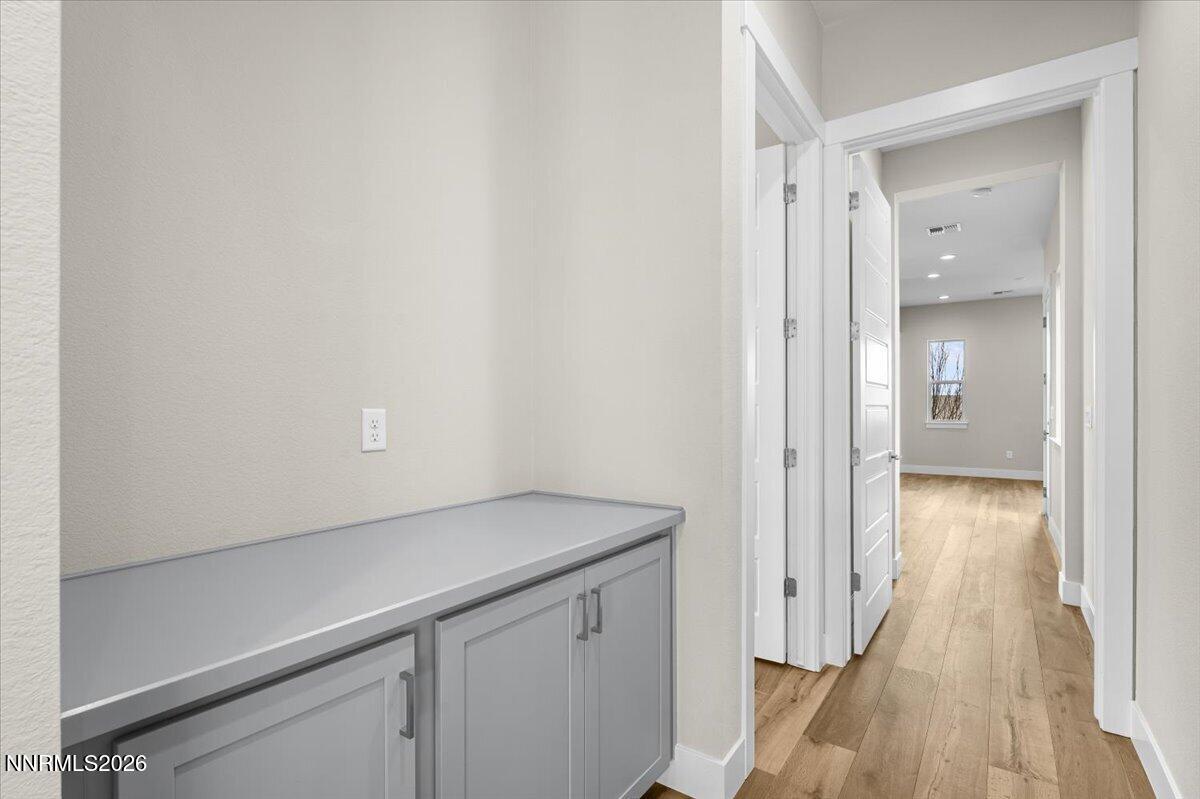 2982 Saddle Peak Drive Reno, NV 89521 - Photo 62 of 98 a view of a hallway with wooden floor