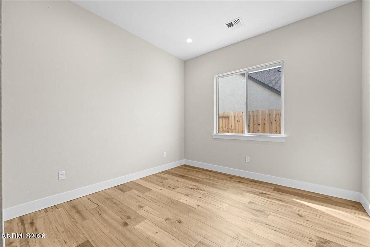 2982 Saddle Peak Drive Reno, NV 89521 - Photo 63 of 98 a view of empty room with wooden floor