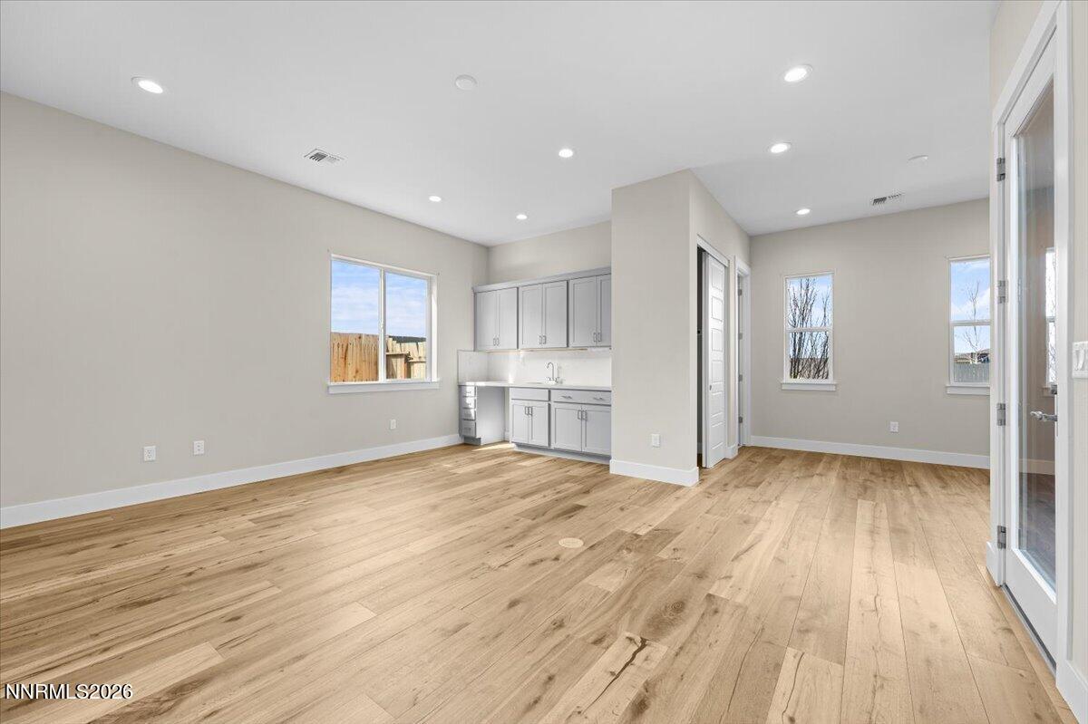 2982 Saddle Peak Drive Reno, NV 89521 - Photo 69 of 98 a view of empty room with wooden floor and windows
