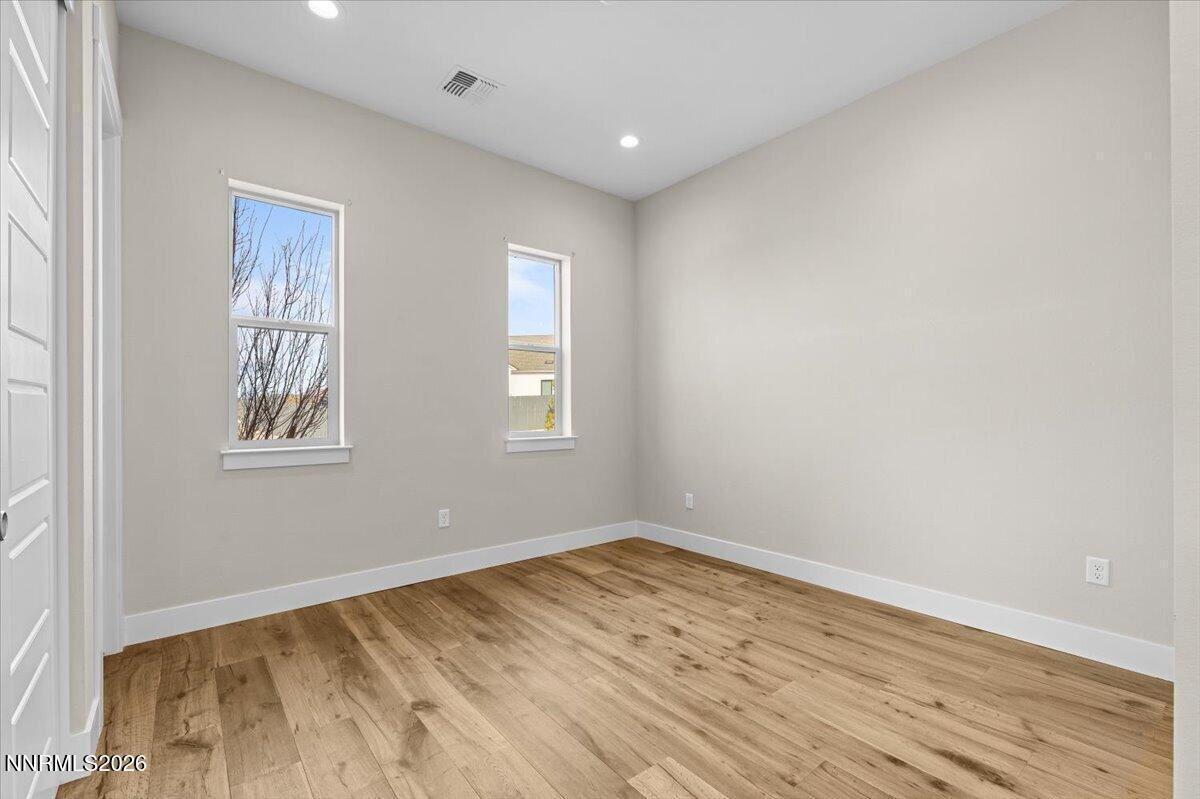 2982 Saddle Peak Drive Reno, NV 89521 - Photo 73 of 98 a view of empty room with wooden floor and fan