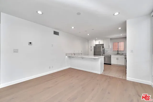 a view of kitchen with wooden floor