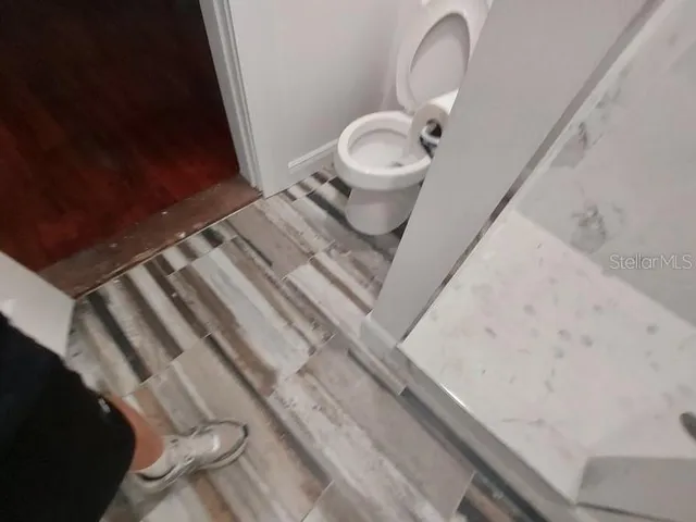 a close view of a sink and a toilet