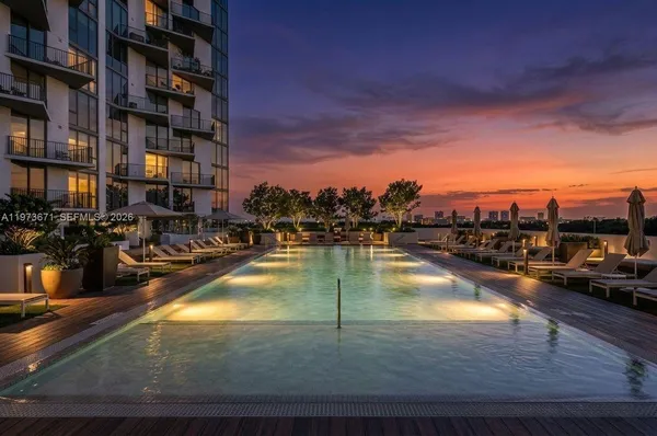 a view of swimming pool with outdoor seating