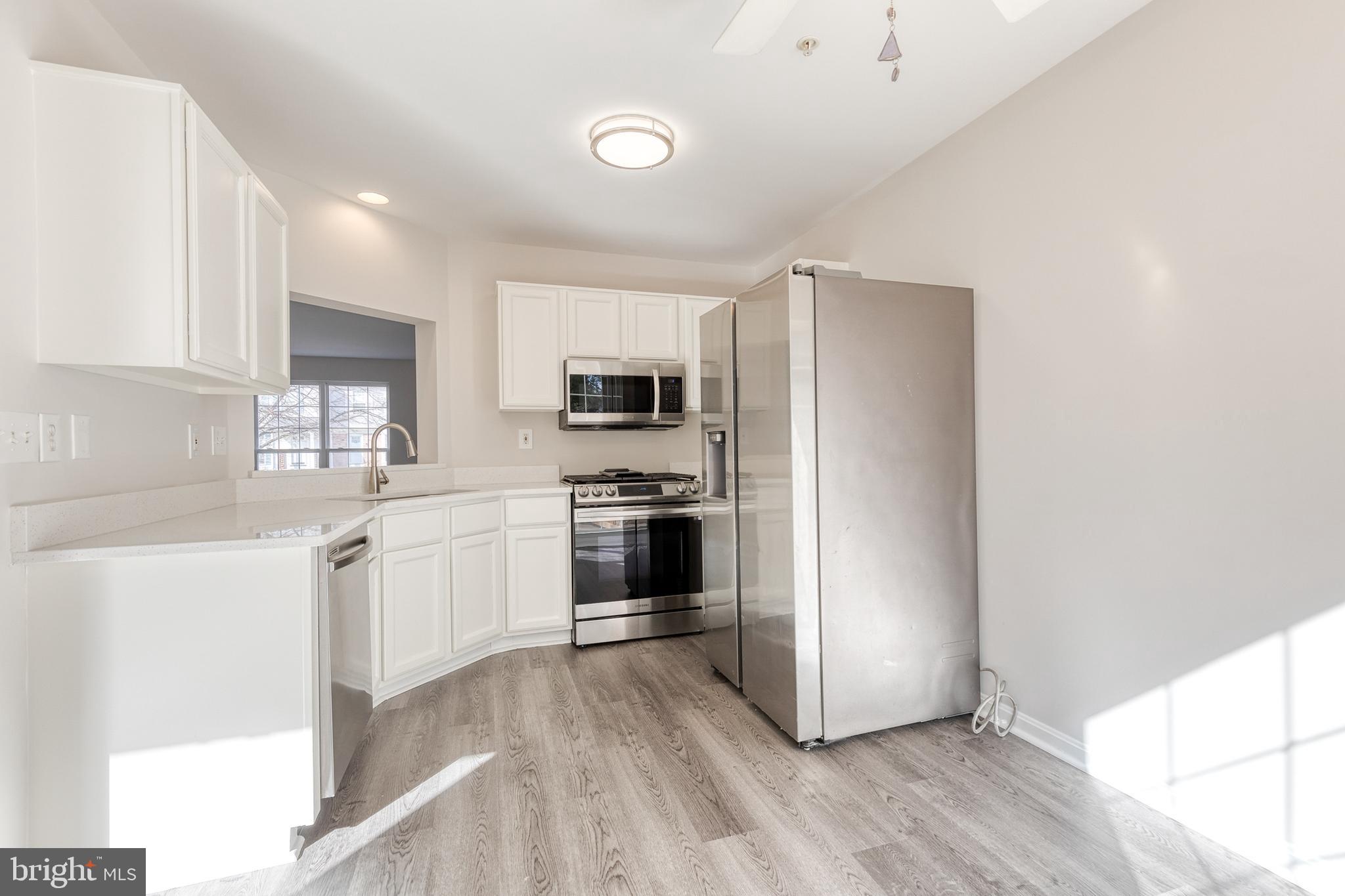 4435 Kentford Road Owings Mills, MD 21117 - Photo 11 of 35 Stainless-steel refrigerator, oven, and dishwasher