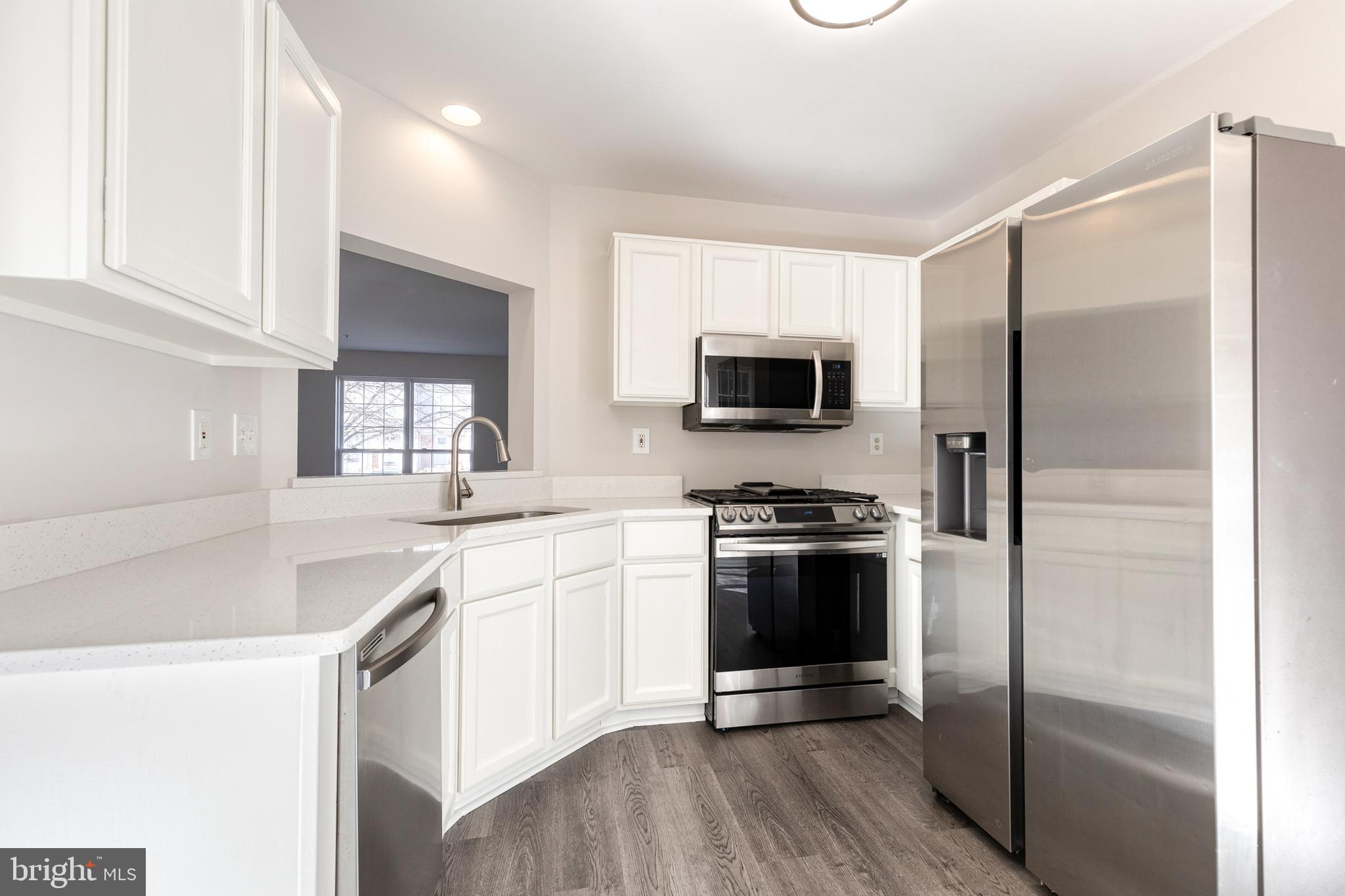 4435 Kentford Road Owings Mills, MD 21117 - Photo 13 of 35 Fresh painted wood cabinets and updated kitchen
