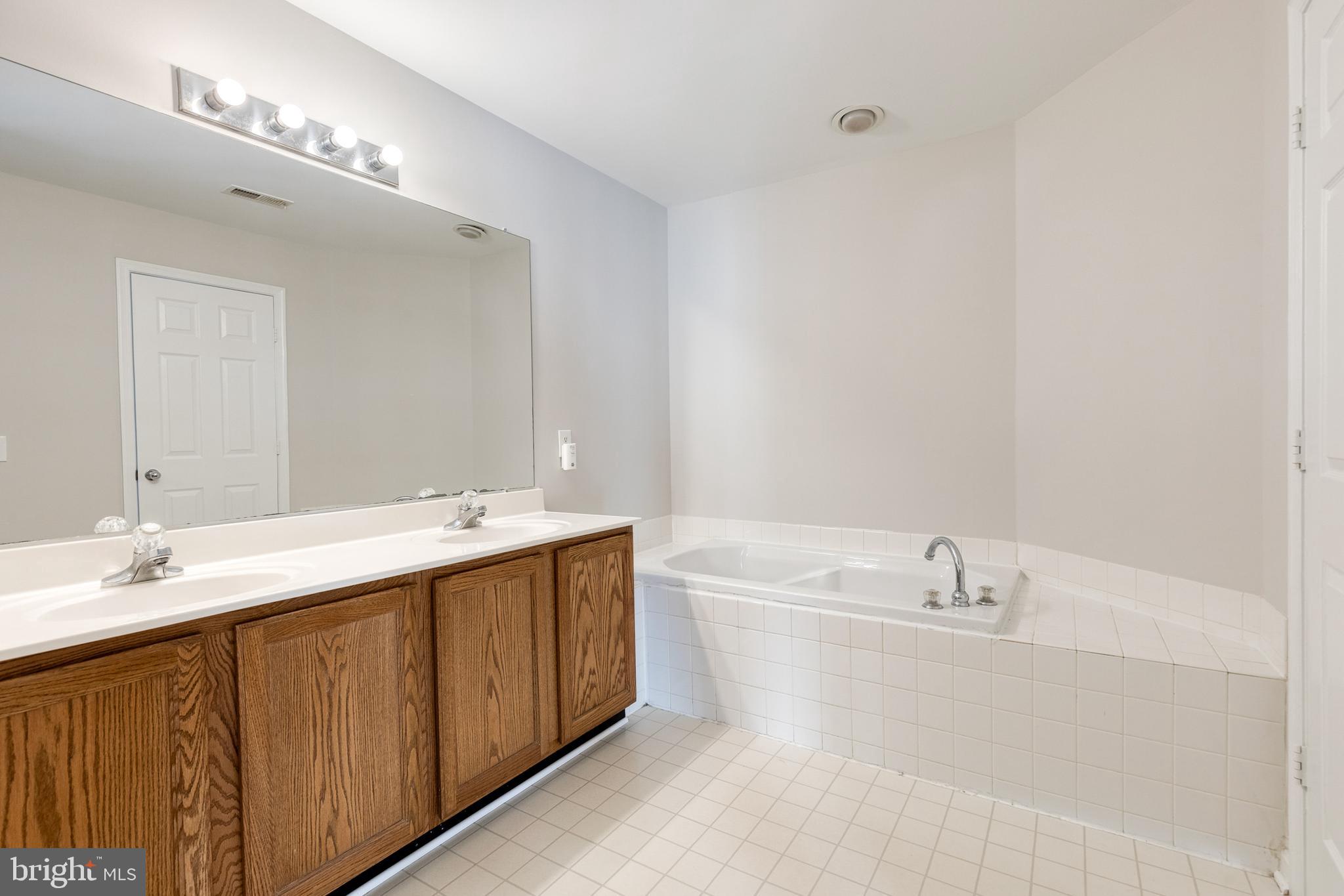 4435 Kentford Road Owings Mills, MD 21117 - Photo 17 of 35 Second floor bath w/double vanity and tub