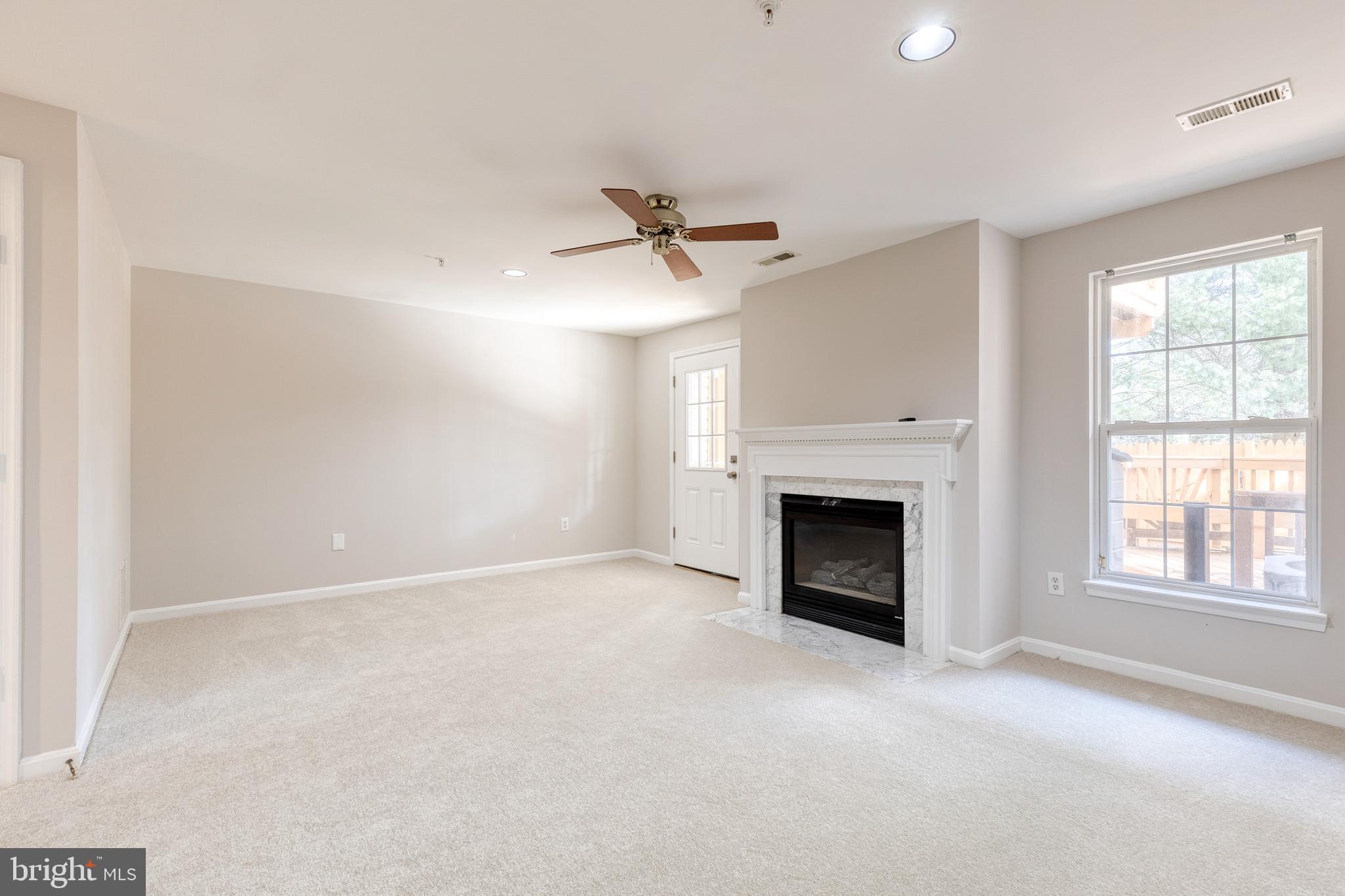 4435 Kentford Road Owings Mills, MD 21117 - Photo 22 of 35 New carpet on lower level w/gas fireplace