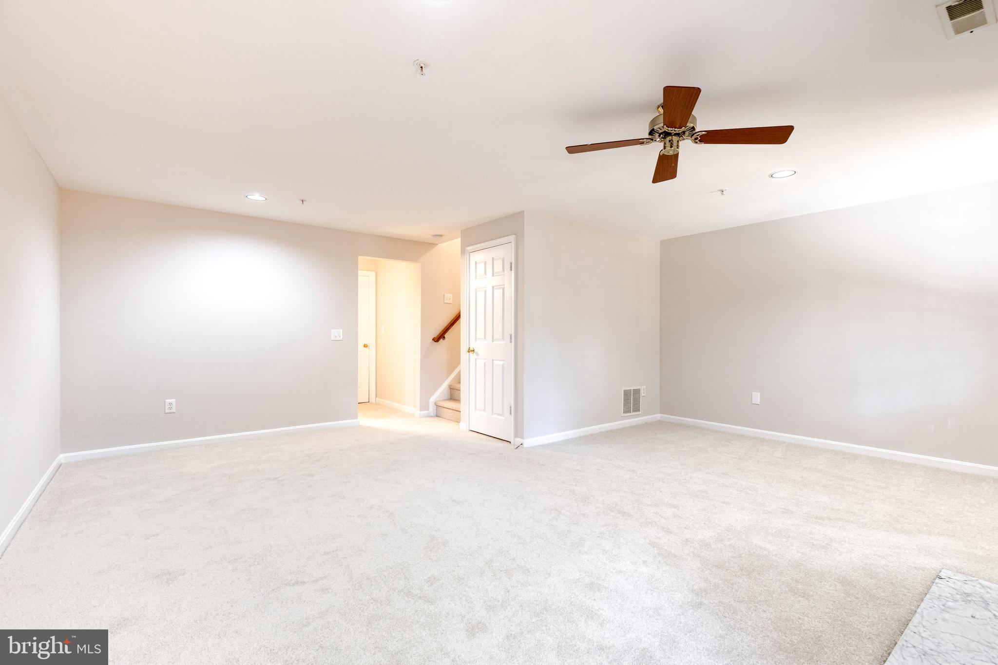 4435 Kentford Road Owings Mills, MD 21117 - Photo 23 of 35 Basement view towards 1/2 bath/stairs and laundry