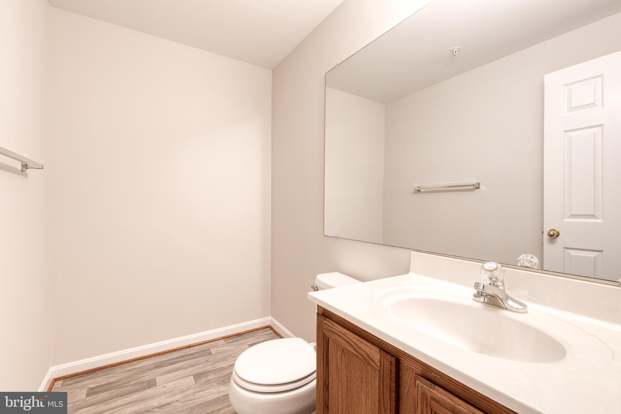 4435 Kentford Road Owings Mills, MD 21117 - Photo 24 of 35 Basement 1/2 bath with luxury vinyl floor