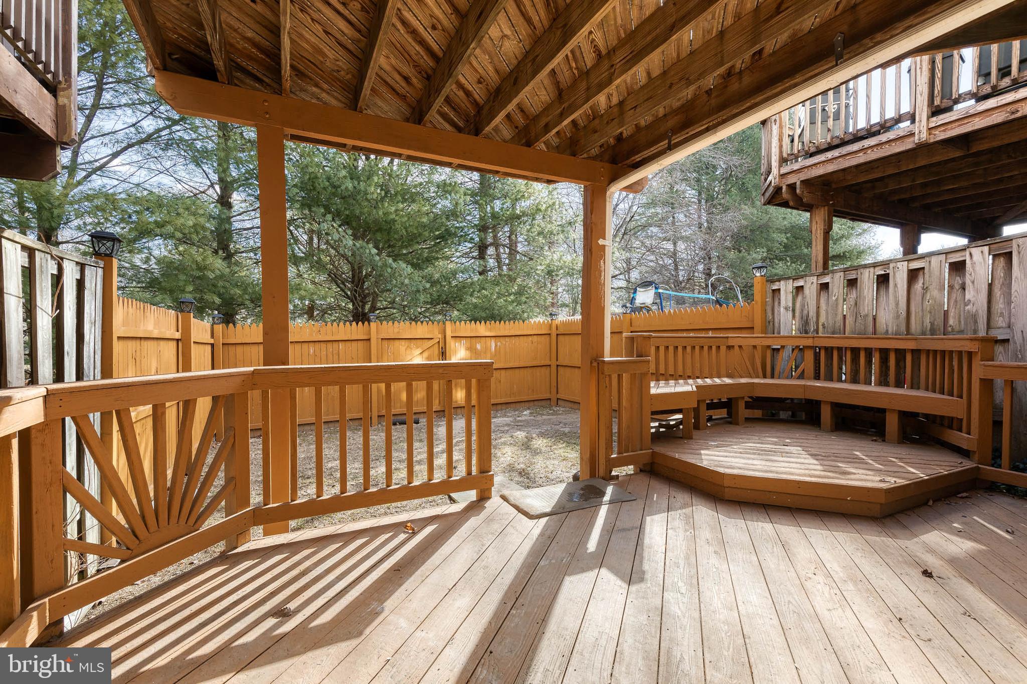 4435 Kentford Road Owings Mills, MD 21117 - Photo 25 of 35 Lower level wood patio and fenced yard
